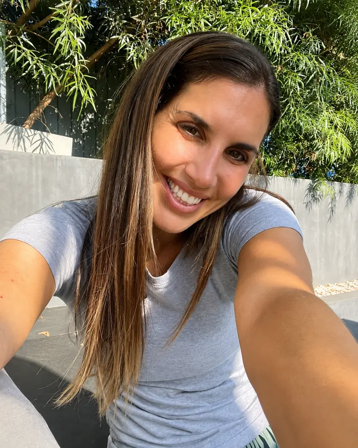 Close portrait of Jen smiling outdoors